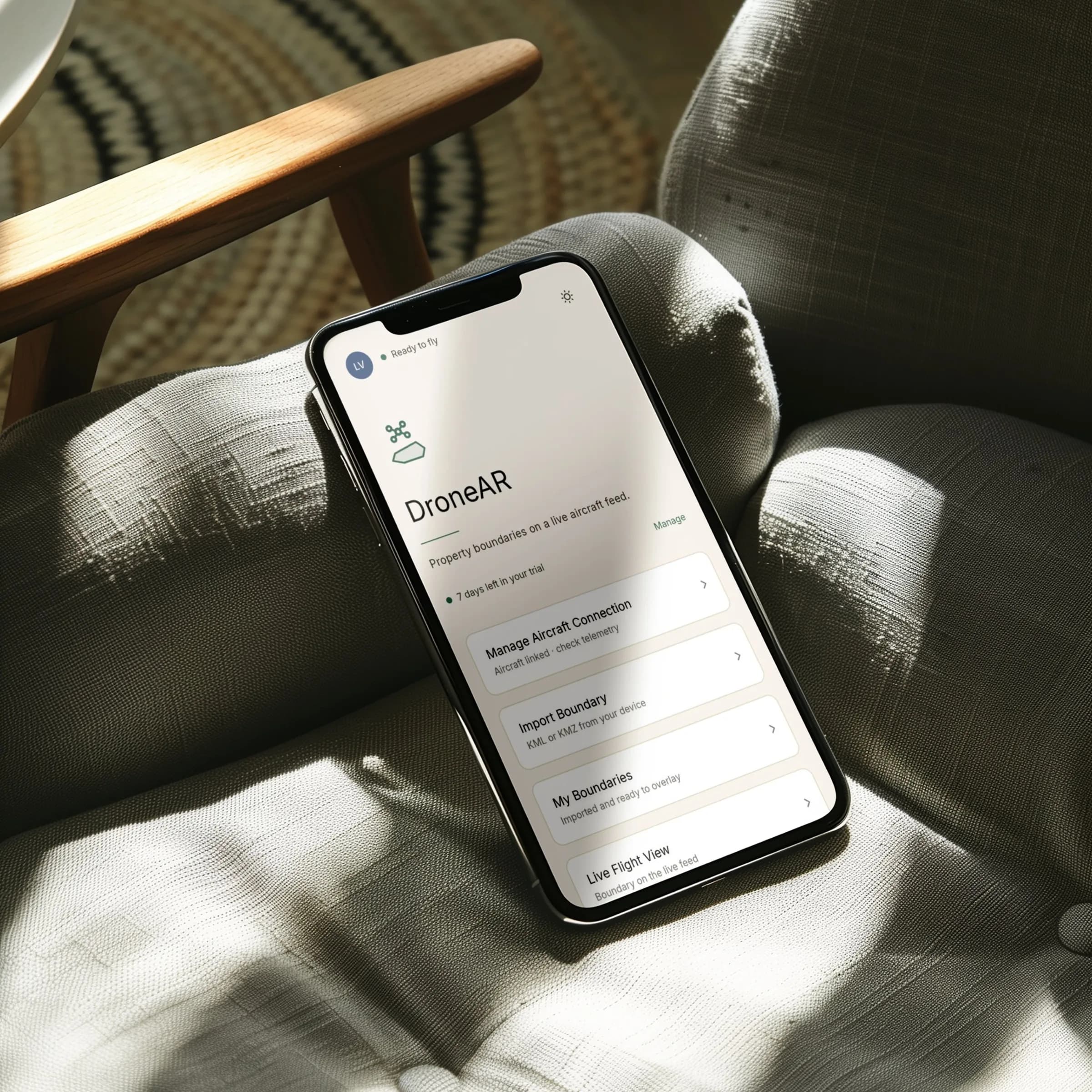 AxoLens app mockup on Android showing the home screen with property library, boundary import, and live flight view